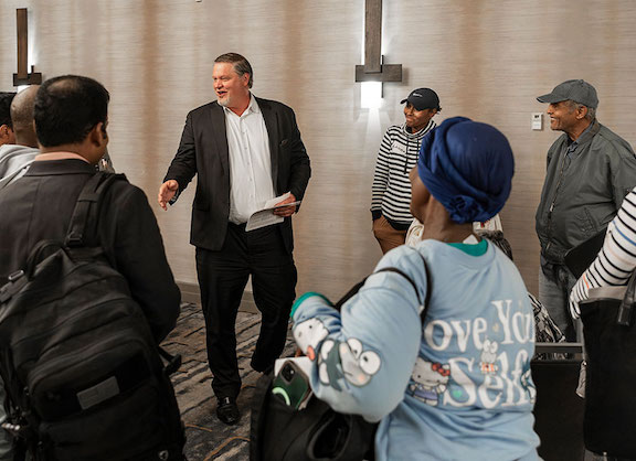 Tax lien investing coach engaging with beginner students at a live training event